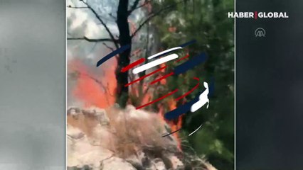 Helikopterden bırakılan suyun altında kaldı