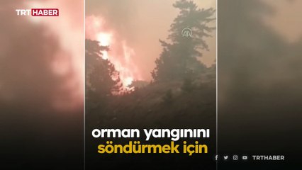 Yangına müdahale eden itfaiye erleri alevlerin ortasında kaldı