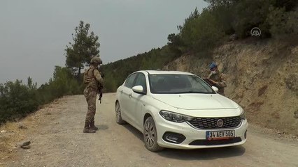 Komandolar yangına karşı milli parkta devriye gezip, cam atık topladı