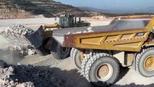 Caterpillar 992K Wheel Loader Loading Caterpillar 777F Dumpers