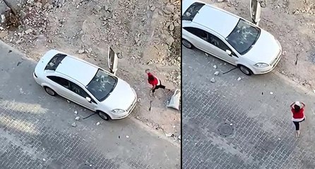 Öfkeli kadın hıncını arabadan çıkardı