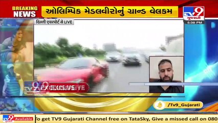 Indian athletes leave for hotel Ashoka after getting rousing welcome at Delhi airport_ TV9News