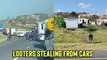 'Disturbing Footage of Looters Stealing from Cars During South Africa Riots'
