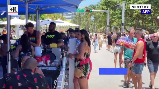 Unmasked Floridians crowd Miami beach as Delta variant spreads through US state