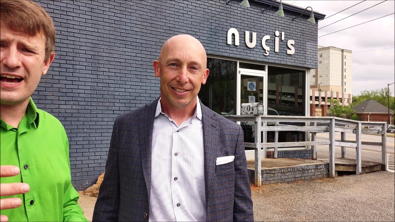 Reign Streiter explains why he chose Nuci's Space as his charitable donation after completing a transaction with Georgui Kassaev My Athens Realtor