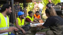 Germany: Refugees join cleanup after floods efforts