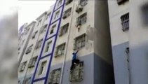 Homem escala prédio para salvar bebé pendurado em janela