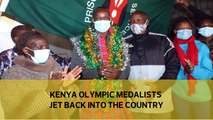 Kenyan medalists jet back into the country