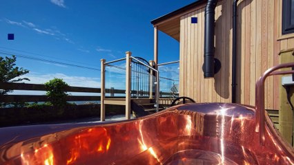 Three Little Huts, with seaviews to the front and rolling hills behind