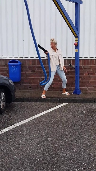 Face Meets Vacuum During Car Wash Dance