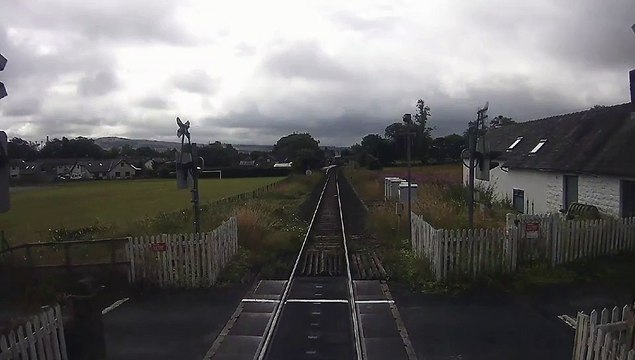 Car in near-miss with train on Cumbria level crossing