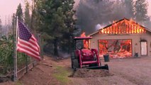 Dozens of California fires threaten thousands of homes and whole towns