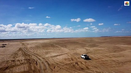 A Pick Up is Travelling on a Desert-Drone Video(HD)