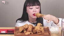KOREAN GIRL EATING BBQ CHICKEN