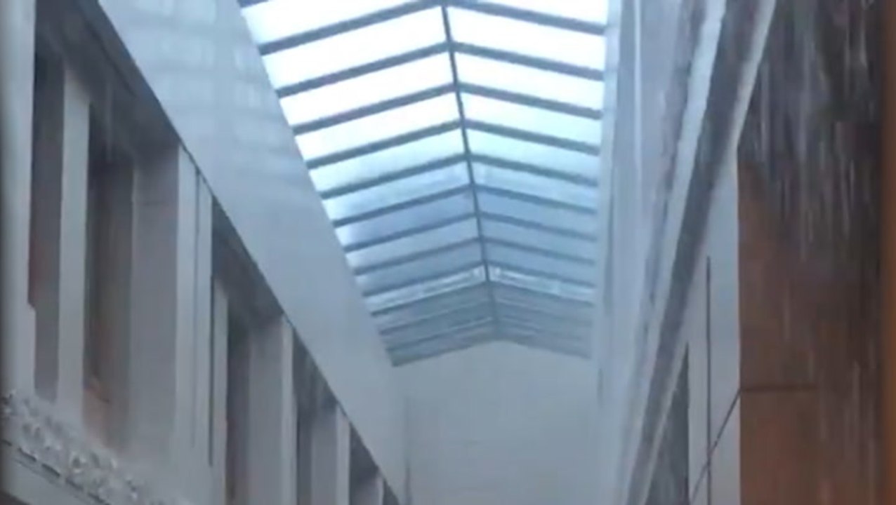 Rain pours down inside Texas State Capitol as storms roll through Austin