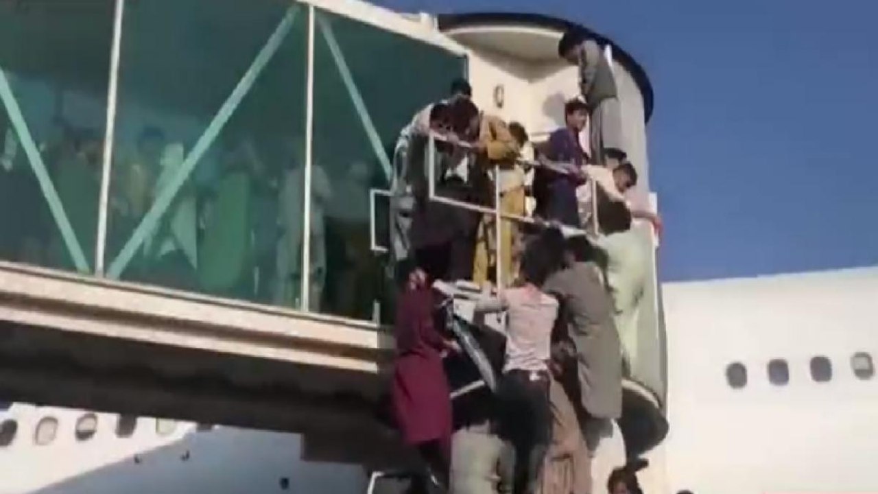 Chaos at Kabul airport as people try to flee country