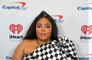 Lizzo breaks down as she calls out 'fat-phobic and racist' abuse