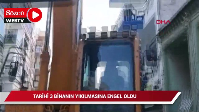 İş makinesinin önüne geçip, tarihi 3 binanın yıkılmasına engel oldu