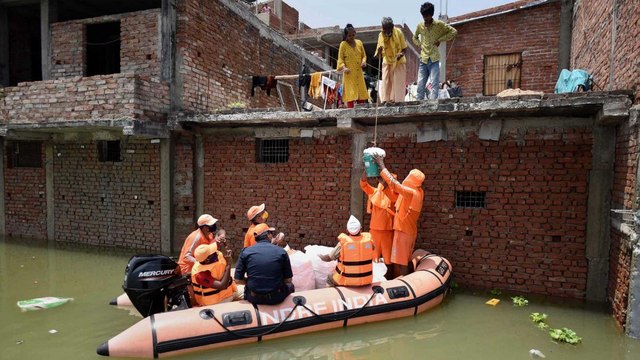 Flood havoc from UP to Bengal, boats on roads, life on roofs