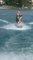 Dad Wakeboards on Water Expertly Holding Daughter in One Hand