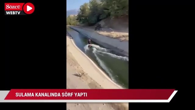 Sulama kanalında sörf yaptı
