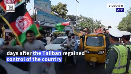 Defiant Afghans wave national flag on independence day after Taliban takeover