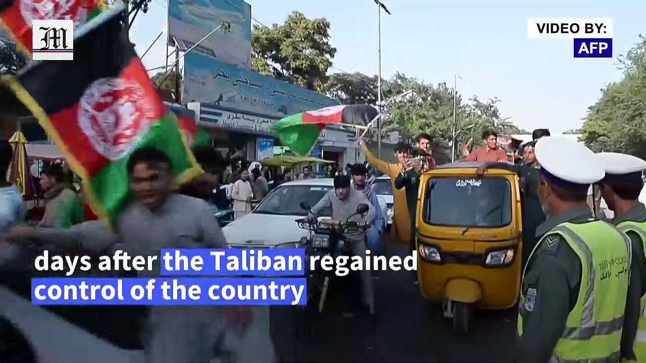 Defiant Afghans wave national flag on independence day after Taliban takeover
