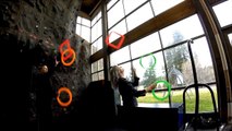 Duo of Jugglers Pass Rings and Square Frames to Each Other While Juggling Them