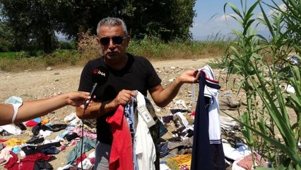 Manavgat'ta yardım için toplanan kıyafetleri dere kenarına attılar