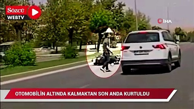 Otomobilin altında kalmaktan son anda kurtuldu