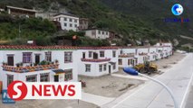 Postmen witness improving postal road network in Tibet