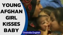 Young Afghan girl kisses baby after landing safely in India, Watch| Oneindia News
