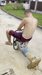 Construction Worker Takes Asphalt Compactor for a Drive