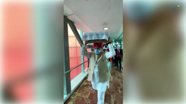Afghanistan Crisis: Union Minister Hardeep Puri receives Guru Granth Sahib at Airport