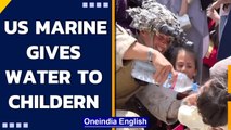 US Marine gives water to Afghan children at Kabul Airport, Watch | Oneindia News
