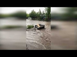 Flash Flooding Sends Couch Floating Down the Street
