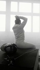 female wall climber undergoes training