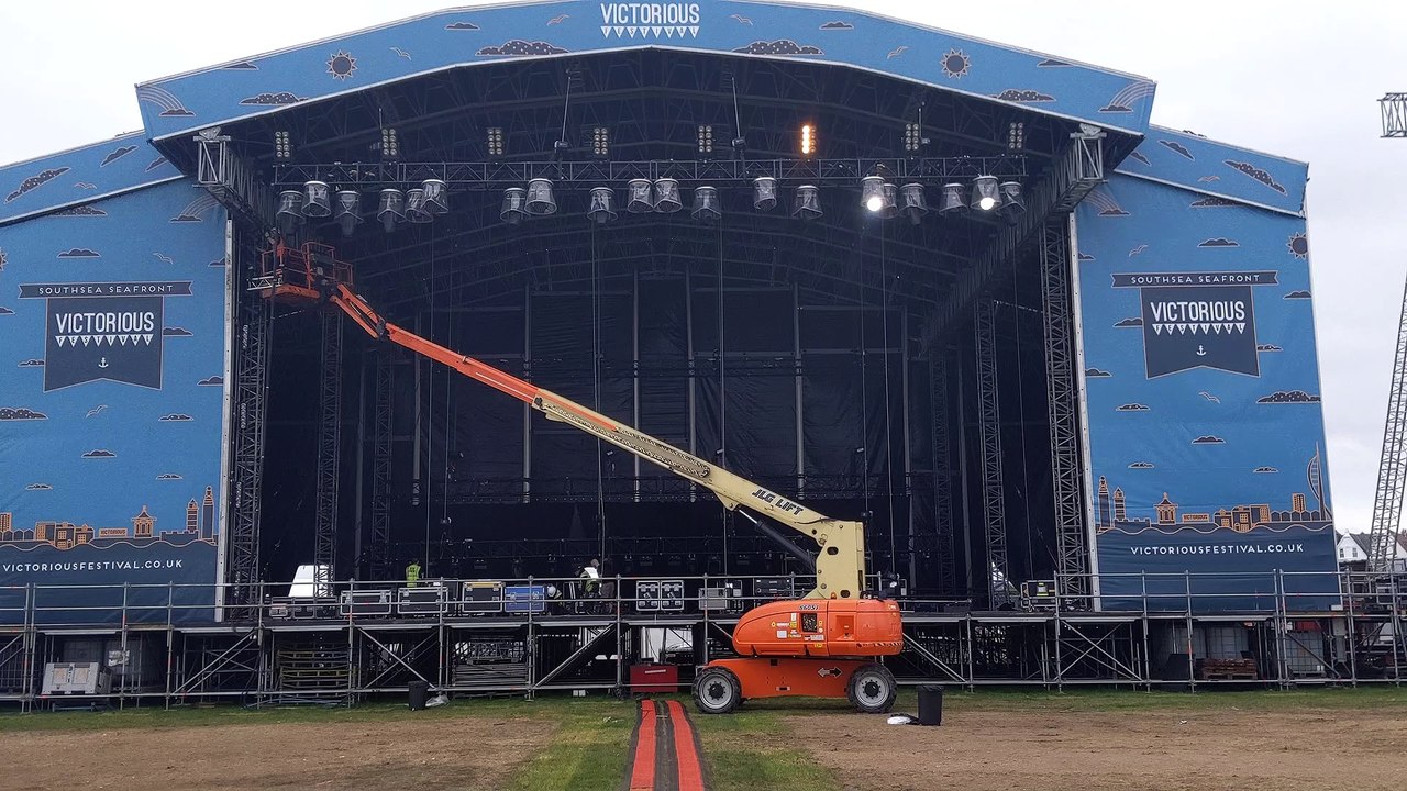 Festival staff work to clear up Southsea Common after Victorious