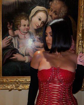 Kourtney Kardashian Paired a Red Lace-Up Corset with Fingerless Opera Gloves