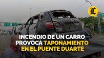 Incendio de un carro provoca taponamiento en el puente Duarte