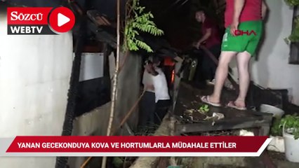 Yanan gecekonduya kova ve hortumlarla müdahale ettiler