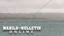 WATCH: One of the six fishermen swims towards the shore in Cataingan town, Masbate province