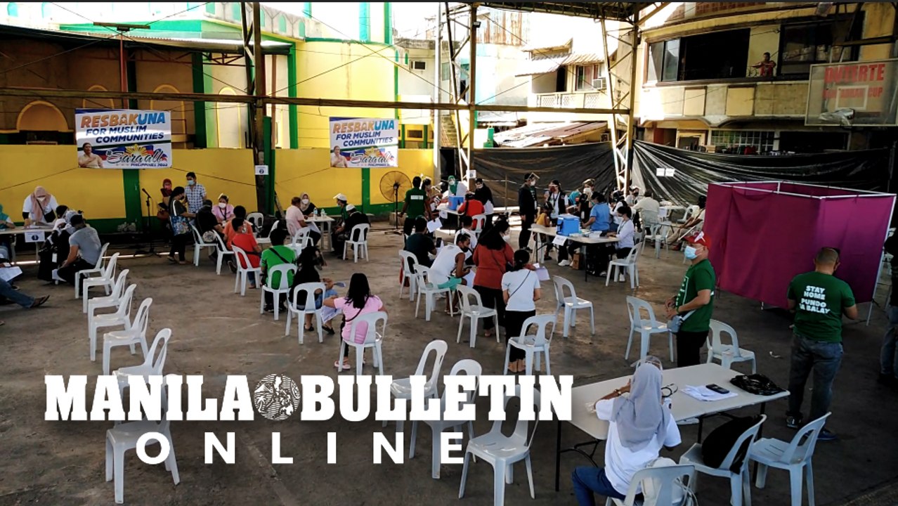 Residents gather for the COVID-19 vaccine rollout for Muslim communities in Davao City