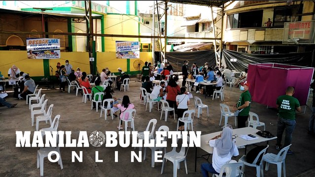 Residents gather for the COVID-19 vaccine rollout for Muslim communities in Davao City