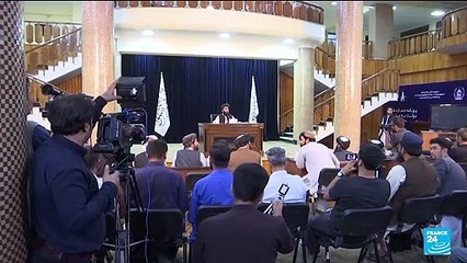 New Taliban government begins work as protests grow