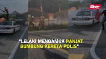 Lelaki mengamuk panjat bumbung kereta polis