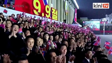 N. Korea puts hazmat suits on parade for national day, but no missiles