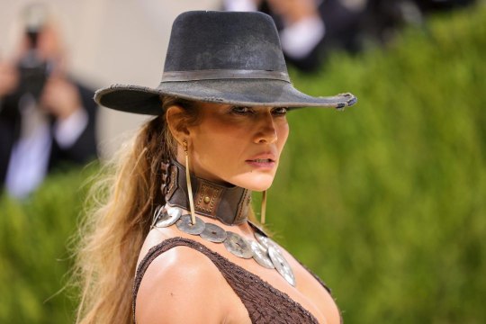 Jennifer Lopez Wore a Cowboy Hat With a Low-Cut, Thigh-Slit Gown at the Met Gala