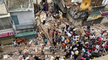 Delhi: 3-storey building collapses, locals remove debris