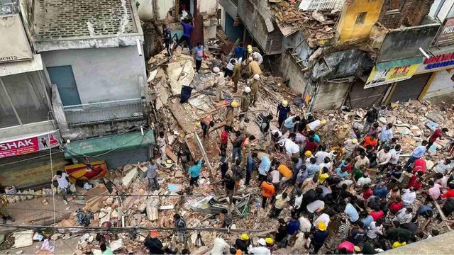 Delhi: 3-storey building collapses, locals remove debris